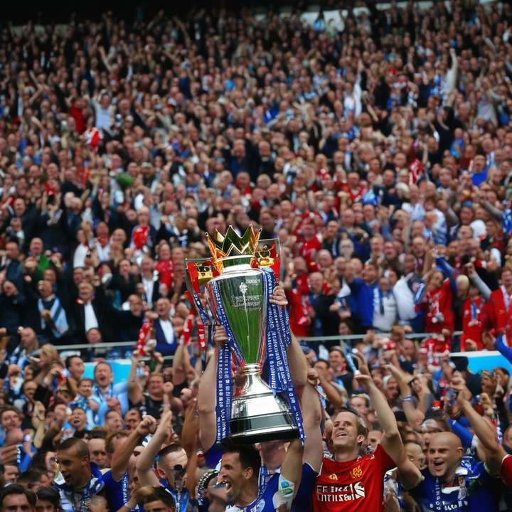 English Premier League football players in action on the field.